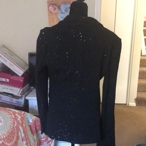 This a cute sparkly black wool mix jacket which add zing to your wardrobe.